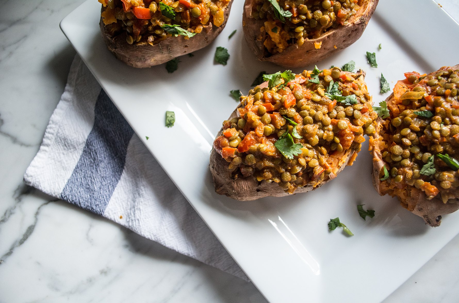 Vegan Lentil Curry Stuffed Sweet Potatoes | Lemons and Basil